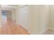 Bright hallway with light wood flooring and double doors at 2871 Sandy Cay St, Clermont, FL 34711