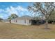 Single-story home with screened patio and grassy backyard at 2871 Sandy Cay St, Clermont, FL 34711