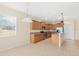 Kitchen with light wood cabinets and granite countertops at 2871 Sandy Cay St, Clermont, FL 34711