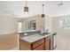 Kitchen with granite counters, stainless steel appliances, and breakfast bar at 2871 Sandy Cay St, Clermont, FL 34711
