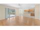 Living room with laminate wood floor and sliding doors to patio at 2871 Sandy Cay St, Clermont, FL 34711