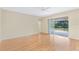Living room with hardwood floors and sliding doors to patio at 2871 Sandy Cay St, Clermont, FL 34711