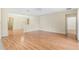 Spacious living room with hardwood floors and a view to the kitchen at 2871 Sandy Cay St, Clermont, FL 34711