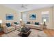 Living room with light beige couches and a coffee table at 2871 Sandy Cay St, Clermont, FL 34711