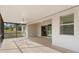 Relaxing screened patio with ceiling fan and view of backyard at 2871 Sandy Cay St, Clermont, FL 34711