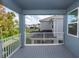 View from balcony shows neighborhood, green space, and a gray wood-look floor at 5648 Green Arrow Pl, Sanford, FL 32773
