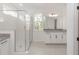 Bathroom features a glass shower enclosure, granite countertop, and white cabinets at 5648 Green Arrow Pl, Sanford, FL 32773