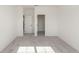 Empty bedroom is bright with neutral carpet and a walk-in closet at 5648 Green Arrow Pl, Sanford, FL 32773