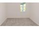 Empty bedroom is bright with neutral carpet and a window at 5648 Green Arrow Pl, Sanford, FL 32773