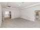 Spacious bedroom with carpet floors, tray ceiling, and adjoining bath and living areas at 5648 Green Arrow Pl, Sanford, FL 32773