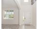 Bright foyer features neutral paint, carpeted living area, and tiled entrance at 5648 Green Arrow Pl, Sanford, FL 32773