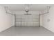 Spacious two car garage with speckled flooring and an automatic door at 5648 Green Arrow Pl, Sanford, FL 32773