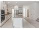 Spacious kitchen featuring white cabinets, stainless steel appliances, and a center island at 5648 Green Arrow Pl, Sanford, FL 32773