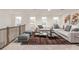 Cozy upstairs living area with neutral paint, large windows, and comfortable furniture at 5648 Green Arrow Pl, Sanford, FL 32773