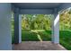 View from covered patio shows yard and green space at 5648 Green Arrow Pl, Sanford, FL 32773
