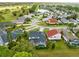 Community aerial view features a lake, golf course, and lush landscaping at 2815 Crane Trace Cir, Orlando, FL 32837