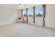 Large bedroom with three windows, play kitchen set, and neutral carpet at 2815 Crane Trace Cir, Orlando, FL 32837