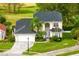Beautiful two-story home with mature landscaping, a manicured lawn, and a brick driveway at 2815 Crane Trace Cir, Orlando, FL 32837