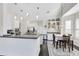 Bright kitchen with granite counters, stainless steel appliances, white cabinetry, and a breakfast nook at 2815 Crane Trace Cir, Orlando, FL 32837