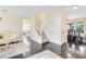 Bright, open-concept home with staircase and dining area adjacent to the living room at 2815 Crane Trace Cir, Orlando, FL 32837
