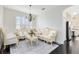 Elegant living room with ornate furniture, chandelier, and natural light at 2815 Crane Trace Cir, Orlando, FL 32837