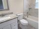 Updated bathroom with a granite countertop and bathtub at 6921 Central Ave, Mulberry, FL 33860