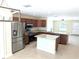 Open kitchen features stainless steel appliances, granite countertops, and a center island at 6921 Central Ave, Mulberry, FL 33860