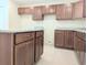 Spacious kitchen featuring granite countertops and wood cabinets at 6921 Central Ave, Mulberry, FL 33860