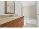 Clean bathroom with granite countertop and tub at 11574 Westwood Blvd # 1112, Orlando, FL 32821
