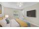 Bedroom with bed, TV, and access to patio at 11574 Westwood Blvd # 1112, Orlando, FL 32821