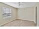 Simple bedroom with window and ceiling fan at 11574 Westwood Blvd # 1112, Orlando, FL 32821
