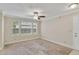 Spacious living room with large windows and carpet at 11574 Westwood Blvd # 1112, Orlando, FL 32821