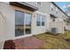 Private backyard patio with brick pavers and sliding glass door access at 16387 Happy Eagle Dr, Clermont, FL 34714