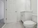 Simple bathroom with white vanity and toilet at 16387 Happy Eagle Dr, Clermont, FL 34714