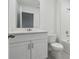Clean bathroom with white vanity, toilet and bathtub at 16387 Happy Eagle Dr, Clermont, FL 34714