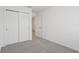 Bedroom with double door closet and grey carpet at 16387 Happy Eagle Dr, Clermont, FL 34714