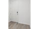Front entry with white door and gray vinyl flooring at 16387 Happy Eagle Dr, Clermont, FL 34714