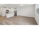 Open concept kitchen with white cabinets and an island at 16387 Happy Eagle Dr, Clermont, FL 34714