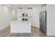 Modern kitchen with white cabinets and a large island at 16387 Happy Eagle Dr, Clermont, FL 34714