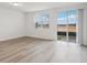 Bright and airy living room with sliding glass door to patio at 16387 Happy Eagle Dr, Clermont, FL 34714