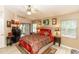 Spacious main bedroom with a king-size bed and access to a patio at 2509 Gables Dr, Eustis, FL 32726