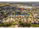 Property location shown in a wide aerial view of the neighborhood and nearby lake at 2657 W Dover Glen Cir, Orlando, FL 32828