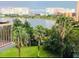 Scenic lake view with palm trees, offering a tranquil and picturesque backdrop at 6165 Carrier Dr # 2, Orlando, FL 32819