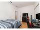 This bedroom features wood-look floors and a computer gaming setup at 1989 Marsh Hen Vlg, Deland, FL 32720