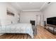 Comfortable main bedroom features tray ceiling and a bench seat at the foot of the bed at 1989 Marsh Hen Vlg, Deland, FL 32720