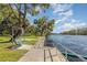 Scenic river view with walking path, benches, and swings for relaxing outdoors at 1989 Marsh Hen Vlg, Deland, FL 32720