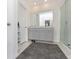 Bathroom with double vanity and walk-in shower at 2582 Glacier Express Ln, Tavares, FL 32778