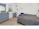 Spacious bedroom with gray carpeting and large window at 2582 Glacier Express Ln, Tavares, FL 32778