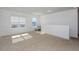 Spacious bonus room with large windows and carpet at 2582 Glacier Express Ln, Tavares, FL 32778