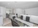 Open concept dining area with glass table and seating for six at 2582 Glacier Express Ln, Tavares, FL 32778